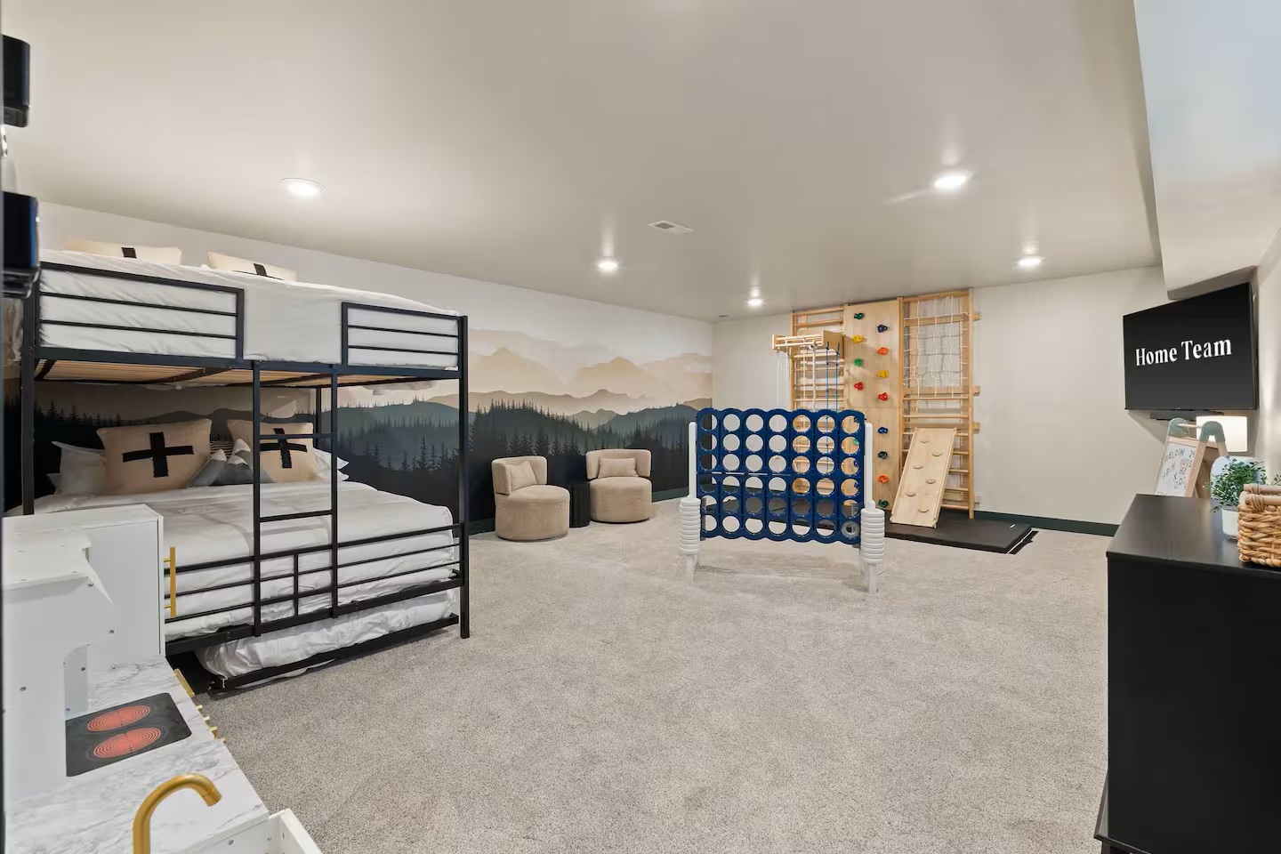 Kids playroom with a climbing wall and toys